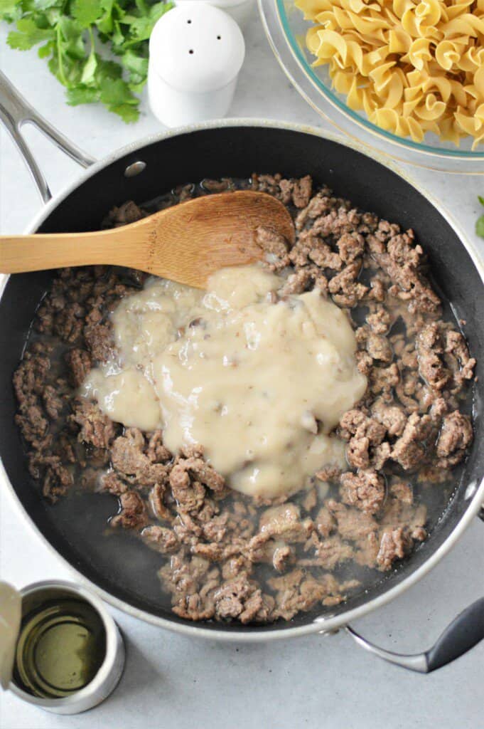 cooked group beef in pan with cream of mushroom soup