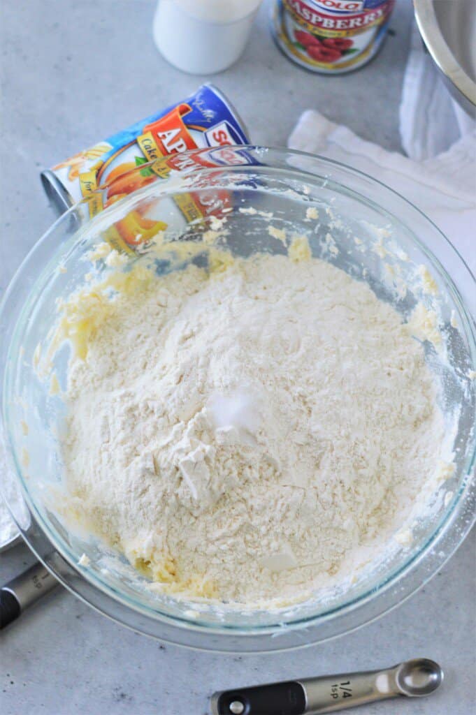 flour and creamed butter in glass bowl