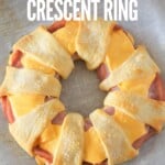 overhead view of whole ham and cheese crescent ring with title text