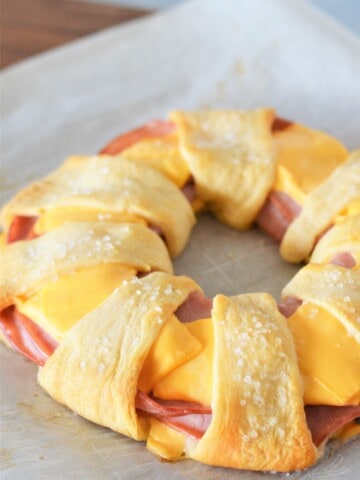 baked ham and cheese ring on parchment paper