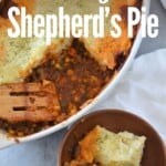 overhead view of shepherd's pie in baking dish and one serving in wooden bowl with title text