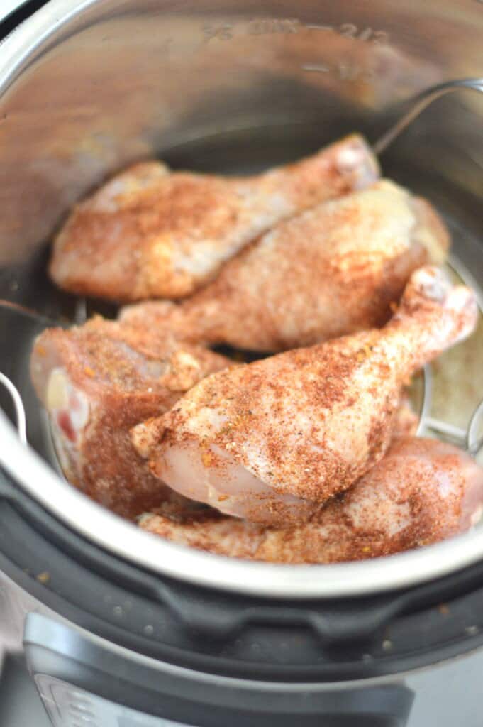 Chicken thighs in an instant pot with spices.