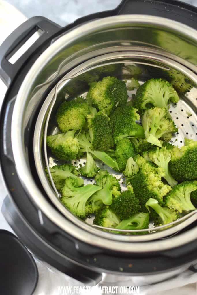 instant pot filled with broccoli in steamer basket