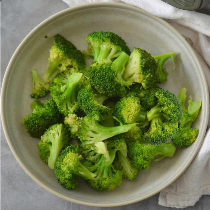 instant pot steamed Broccoli in a bowl on a table.