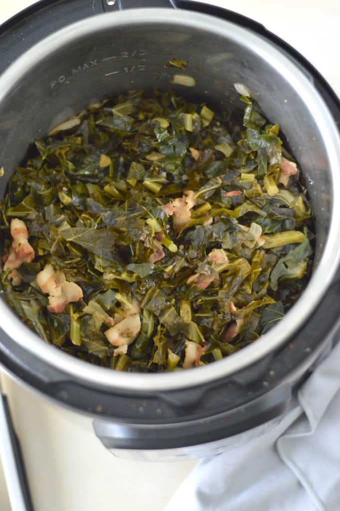 A pot of greens and bacon in an instant pot.