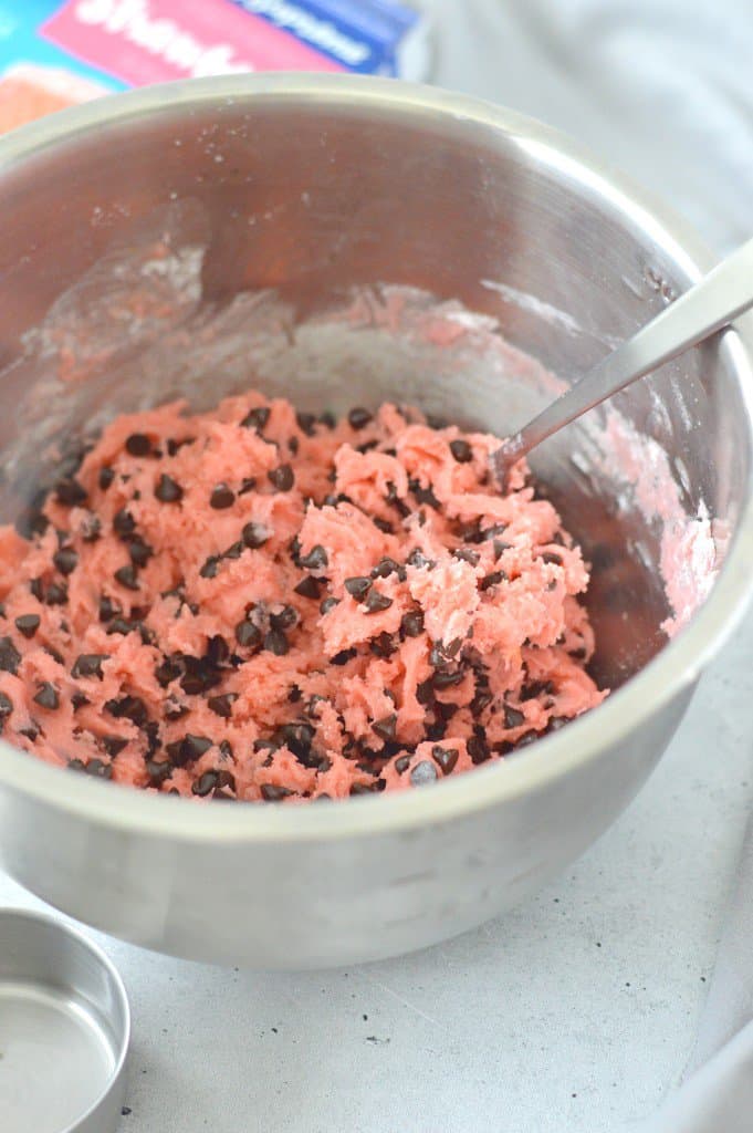strawberry chocolate chip cookie dough in a bowl with a spoon.