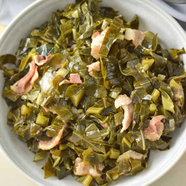 instant pot collard greens with bacon in a white bowl.