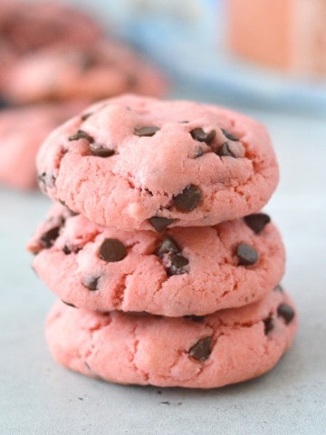 strawberry chocolate chip cookies stacked on top of each other.