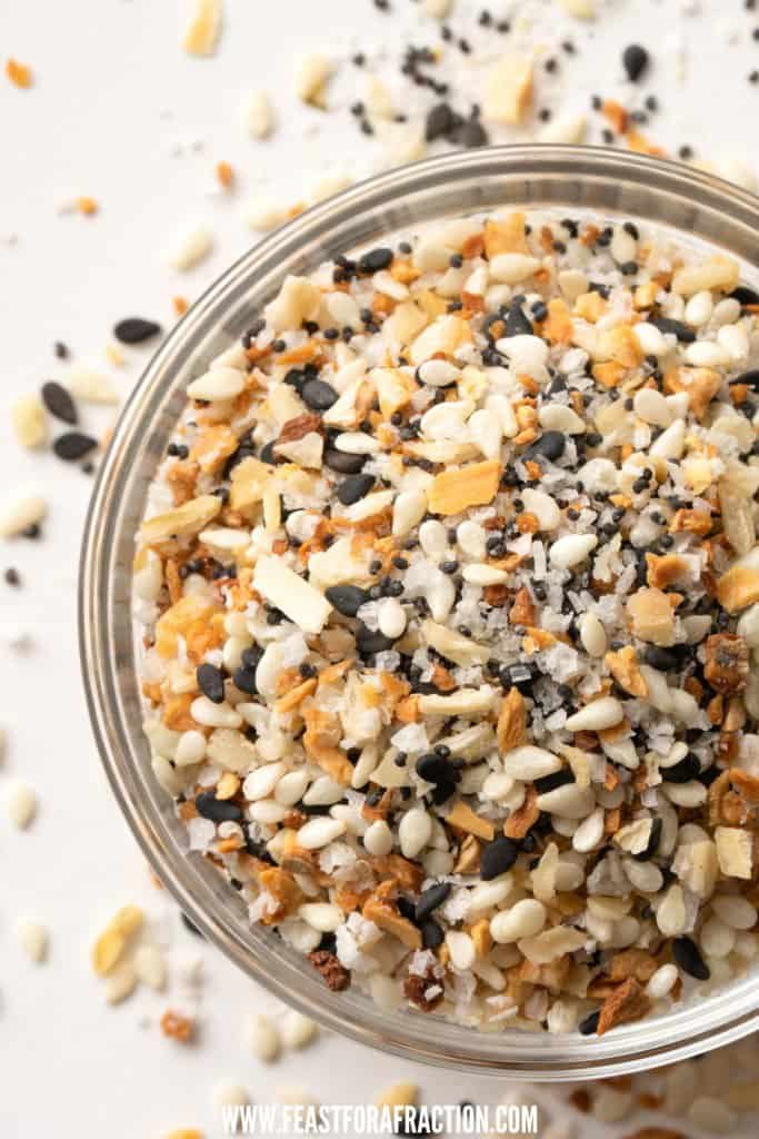 overhead view of homemade everything bagel seasoning in glass jar