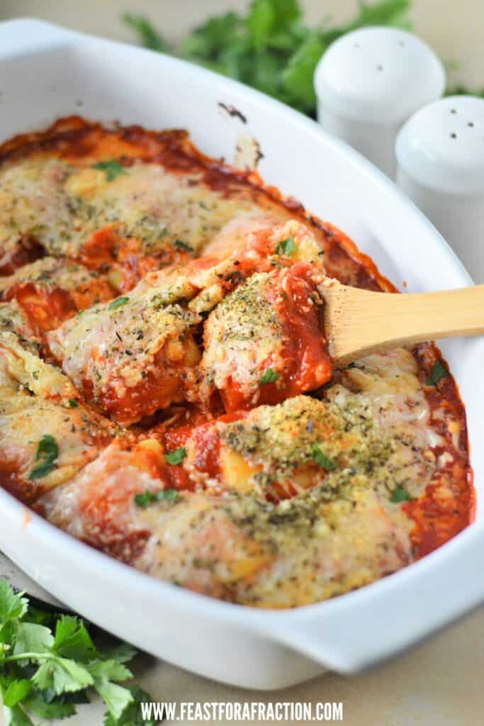 lazy lasagna in white casserole dish with salt and pepper shakers in background
