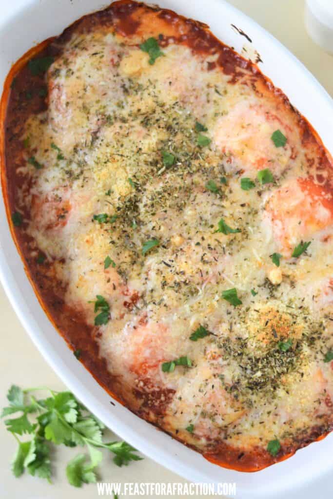 overhead view of baked ravioli topped with cheese