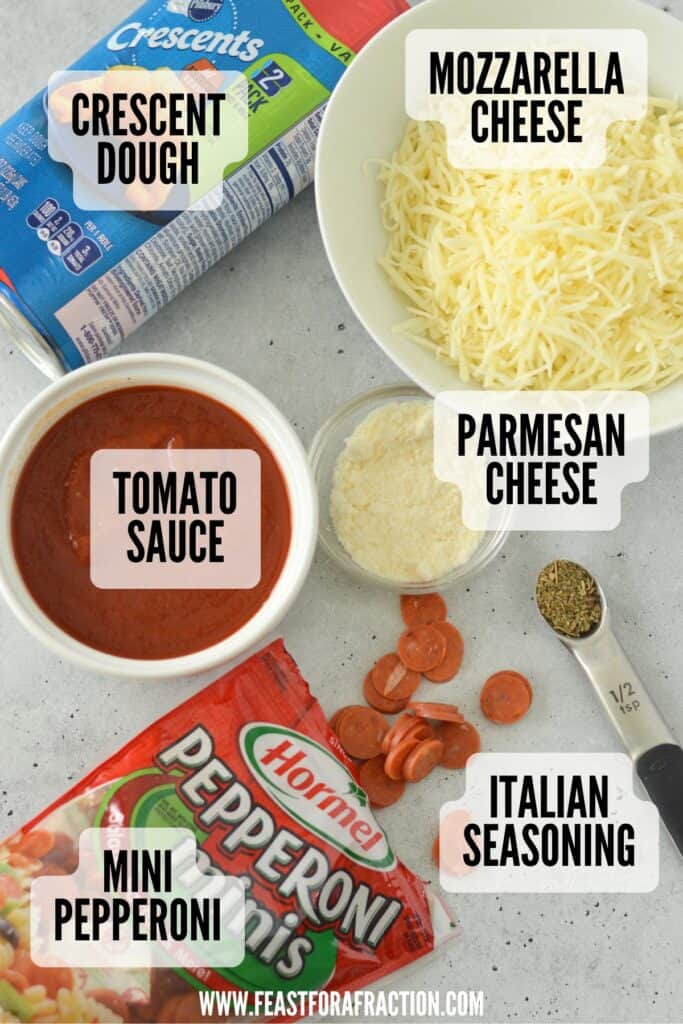 ingredients for pizza pinwheels: crescent dough, mozzarella cheese, parmesan cheese, italian seasoning, mini pepperonis, and tomato sauce