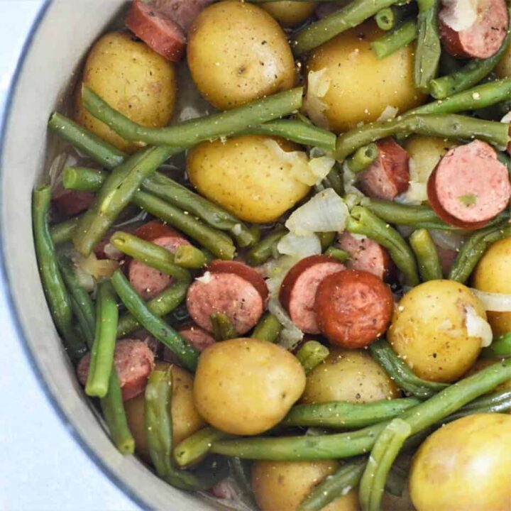 whole petite potatoes, green beans and smoked sausage in pot